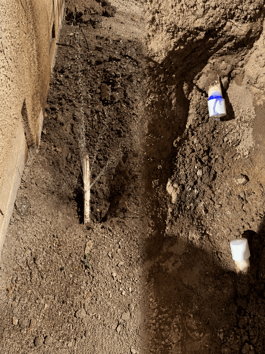 RS Plumbing technicians repairing an underground pipe mainline during an emergency plumbing service in Marina, CA.